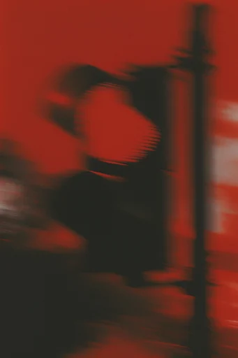 Crimson Noir Surrealism style reference image — ethereal smoke and motion blur