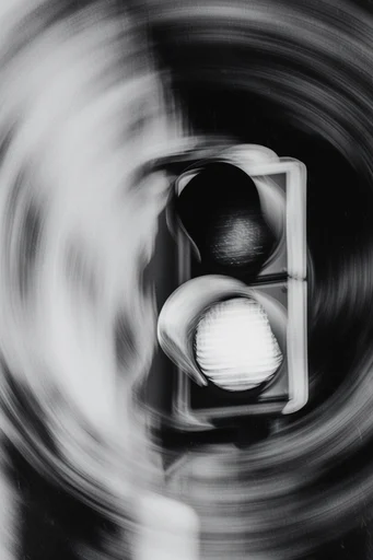 Monochrome Kinetic Vortex style reference image — radial motion blur