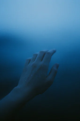 Cinematic Nocturnal Minimalism style reference image — heavy 35mm film grain