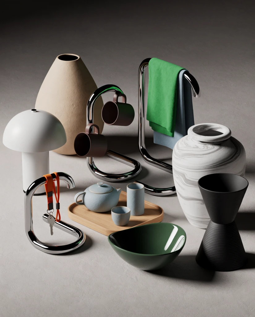 A curated arrangement of minimalist design objects rests on a textured neutral grey studio sweep under soft directional lighting. The layout features diverse geometric and organic shapes, including a white cylindrical domed lamp, a large textured beige teardrop vase, and three S-curved tubular chrome stands. One small stand holds an orange lanyard with a silver key, a taller one hangs two dark brown cylindrical mugs, and the third is draped with bright green and muted blue fabrics. A central light wood tray displays a textured pale blue ceramic tea set, positioned near a glossy dark green asymmetrical bowl in the foreground. The right side is anchored by a large white and grey marbled urn and a tall matte black hourglass-shaped ribbed vessel. The scene embodies a high-end 3D product rendering aesthetic, emphasizing the rich tactile contrasts between matte ceramics, highly reflective polished chrome, and soft folded textiles.
