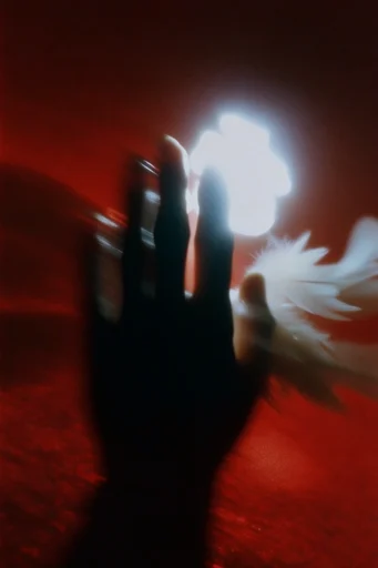 Ethereal Crimson Noir style reference image — heavy film grain