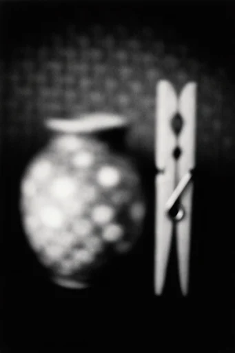 Ethereal Noir Abstraction style reference image — heavy film grain