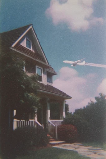 Analog Nostalgic Realism style reference image — low angle cinematic perspective