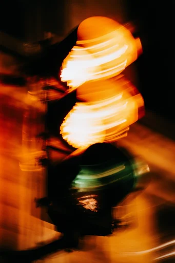 Kinetic Amber Dreamscape style reference image — long exposure light streaks