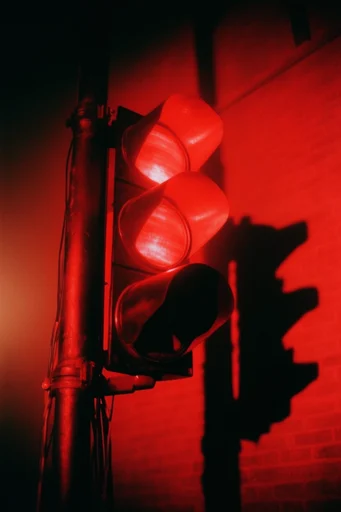 Cinematic Crimson Noir style reference image — high-contrast chiaroscuro