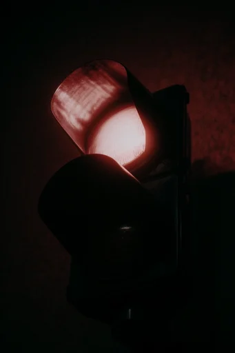 Cinematic Noir Grain style reference image — chiaroscuro lighting
