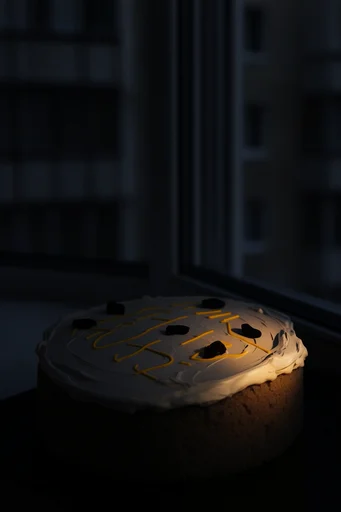 Monolithic Nocturnal Brutalism style reference image — warm window glow
