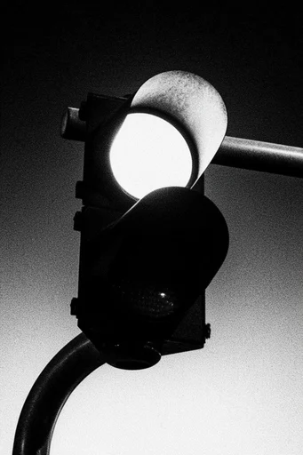 Tactile Noir Minimalism style reference image — heavy film grain