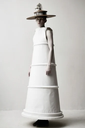 Monochromatic Sculptural Minimalist style reference image — avant-garde fashion