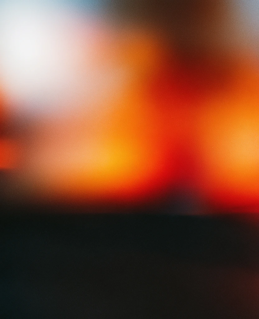 extremely defocused bokeh, heavy monochromatic stippled film grain, high-contrast chiaroscuro with a luminous internal glow, deep charcoal negative space in the lower half, ethereal bloom, hazy dreamlike quality, saturated warmth bleeding into dark shadows, a wedge of blue cheese on crumpled parchment paper, a pear slice to the left, two walnut halves in the foreground, background whole pear and slice on a wooden surface, subjects rendered as soft-edged abstract color fields, atmospheric hazines