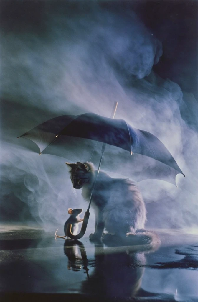cinematic shot of a fluffy cat and tiny mouse huddled under a dark umbrella, low angle composition on a wet reflective floor, thick swirling atmospheric smoke and ethereal mist, dramatic cool-toned blue and indigo monochromatic color palette, soft rim lighting, hazy soft focus, motion blur, grainy film texture, moody mysterious high-fashion editorial aesthetic, deep shadows, long exposure feel, 35mm film style