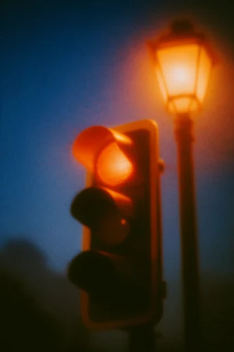 Ethereal Nocturnal Analog style reference image — twilight blue and amber contrast