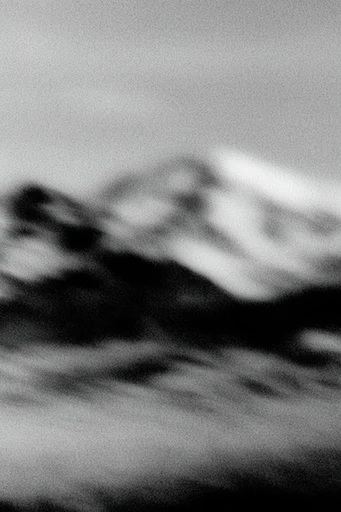 Kinetic Noir Abstraction style reference image — heavy analog film grain