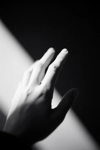 Cinematic Chiaroscuro Noir style reference image — minimalist geometric framing