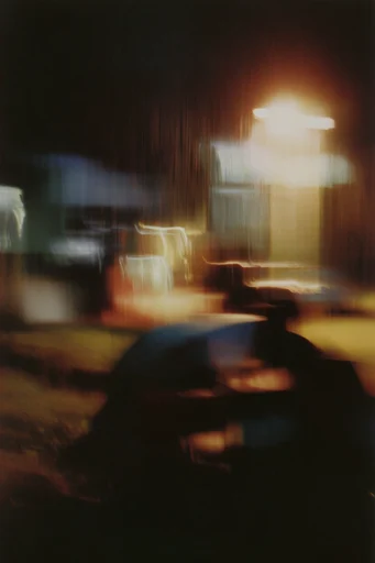 Kinetic Nocturnal Haze style reference image — cinematic film grain