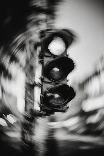 Monochrome Kinetic Vertigo style reference image — radial vortex distortion