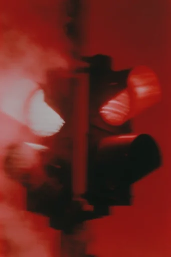 Crimson Spectral Noir style reference image — heavy analog film grain