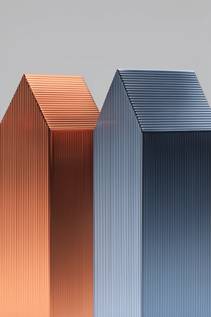 Two tall, house-shaped geometric prisms with finely ribbed metallic textures stand against a seamless light grey backdrop. The left object shines in a vibrant copper-orange gradient, alongside the right object in a cool slate-blue finish. Both minimalist structures feature vertical fluting along their bodies and horizontal fluting across their angled, pitched tops. Soft directional studio lighting strikes the glossy corrugated surfaces, creating precise reflective highlights in a sleek, high-end industrial design aesthetic.