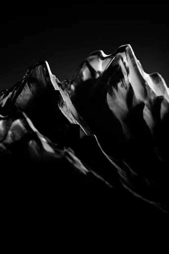 Monochrome Refractive Minimalism style reference image — chiaroscuro lighting