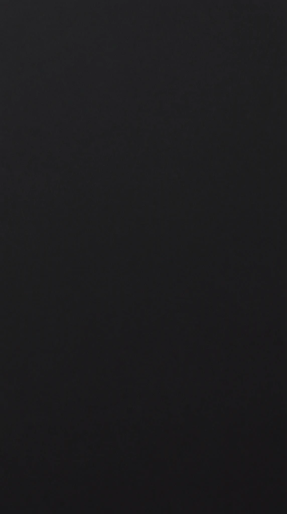 pitch black canvas, deep charcoal gray field, subtle monochromatic film grain texture spread evenly across the frame, minimalist empty composition, pure dark void, matte surface finish, complete absence of light and subjects, stark minimalism, atmospheric noise overlay, completely uniform blank background, unlit space, profound darkness, uniform tone