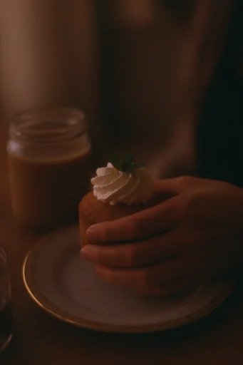 Cinematic Intimate Chiaroscuro style reference image — warm amber tones