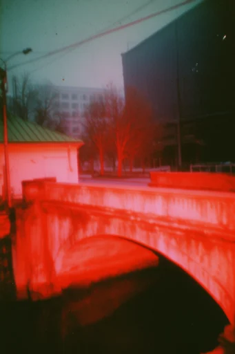 Crimson Analog Noir style reference image — saturated crimson lighting