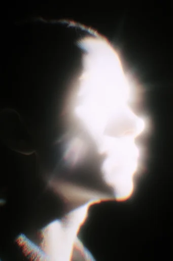Ethereal Spectral Chiaroscuro style reference image — heavy film grain