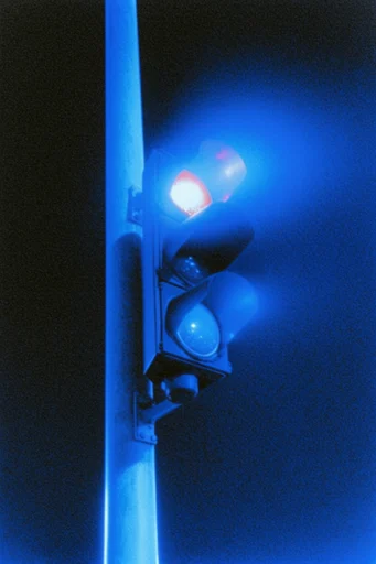 Electric Cobalt Noir style reference image — heavy film grain