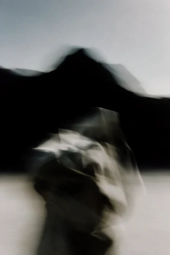 Ethereal Chiaroscuro Motion style reference image — intentional motion blur