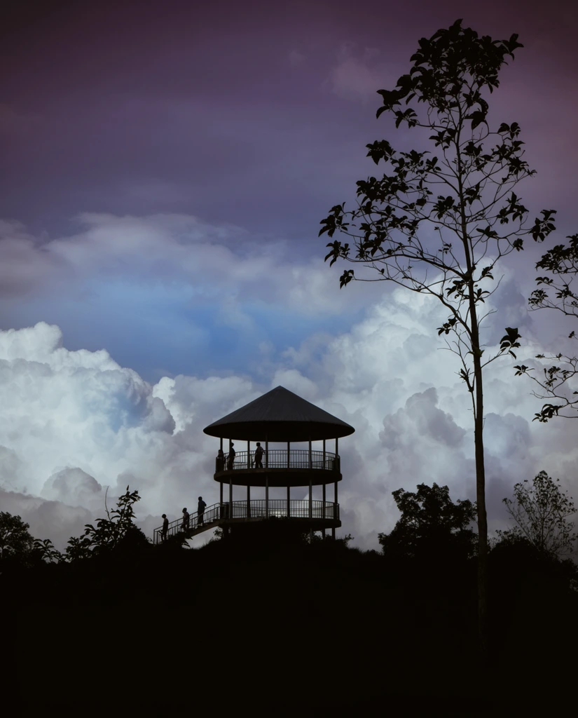A silhouetted observation tower stands on a hill against a dramatic sky filled with large, billowing cumulus clouds. The two-story circular structure features a conical roof and railings on both levels. Several human figures appear as dark silhouettes on the upper deck and ascending the staircase on the left. The foreground is a solid black silhouette of uneven terrain covered in foliage and trees. A tall, slender tree with sparse leaves rises on the right side of the frame, reaching towards the top edge. The sky transitions from a deep, dusky purple at the top to lighter blue and white hues where the massive cloud formations dominate the background, creating a stark contrast with the silhouetted elements in the foreground.