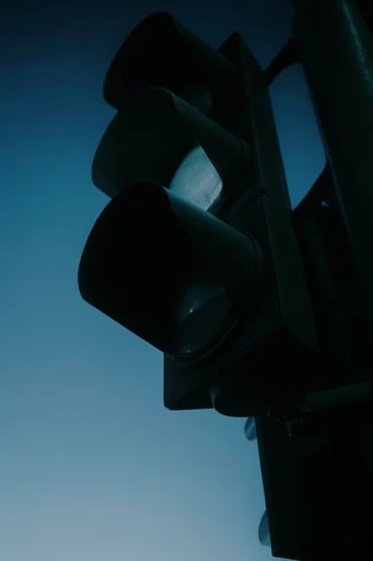 Cinematic Noir Minimalism style reference image — cool cyan and blue color grading