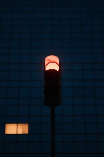 Luminous Urban Solitude style reference image — stark blue hour contrast
