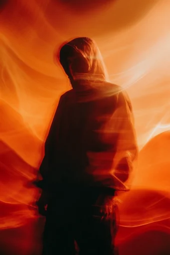 Luminous Amber Silhouette style reference image — amber and red gradient