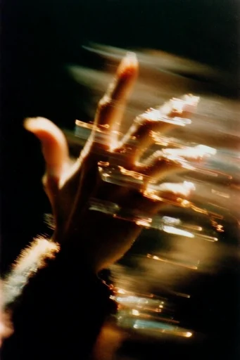 Ethereal Kinetic Noir style reference image — shutter drag
