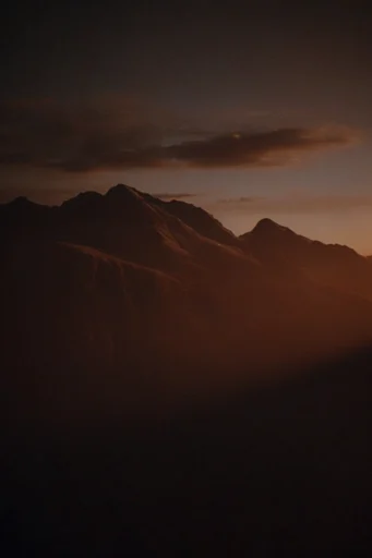 Cinematic Intimate Chiaroscuro style reference image — low-key lighting