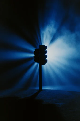Monochromatic Cobalt Noir style reference image — volumetric blue light