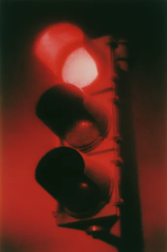 Crimson Noir Glitch style reference image — heavy analog film grain