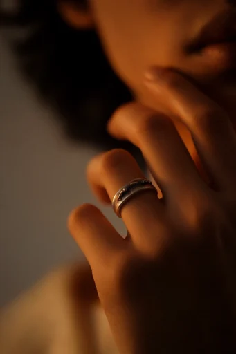 Intimate Amber Chiaroscuro style reference image — golden amber glow