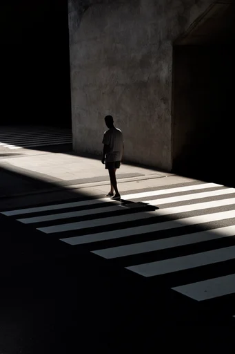 Cinematic Urban Chiaroscuro style reference image — high-contrast urban geometry