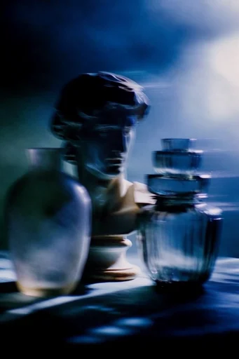 Ethereal Nocturnal Noir style reference image — cyan halation
