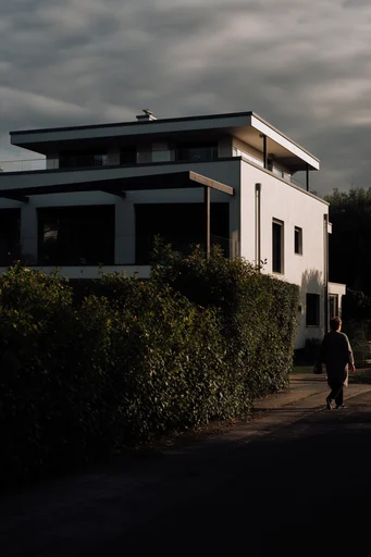 Cinematic Geometric Chiaroscuro style reference image — cinematic urban isolation