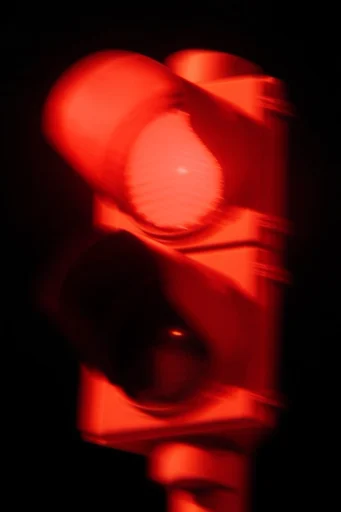 Cinematic Crimson Noir style reference image — dramatic chiaroscuro portrait