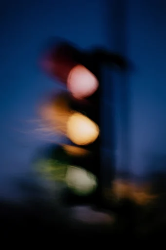 Luminous Nocturnal Chiaroscuro style reference image — deep indigo and amber palette