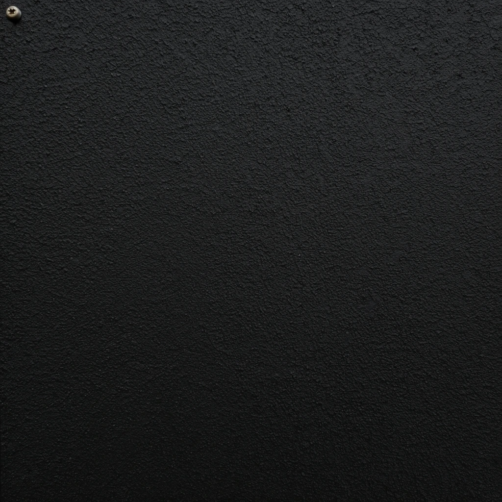 stark matte black surface, heavily textured rough wall, granular finish resembling dark painted stucco or fine asphalt, minimalist aesthetic, single small metallic screw head in the extreme top left corner, flat frontal perspective, dark monochromatic palette, stark micro-shadows highlighting gritty topography
