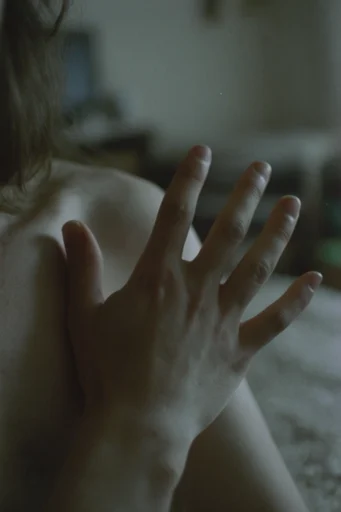 Nostalgic Cinematic Realism style reference image — moody low-key lighting