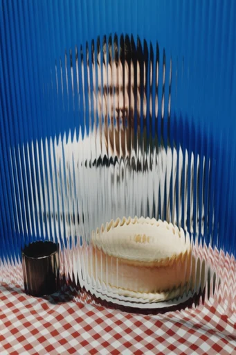 Refractive Noir Surrealism style reference image — avant-garde styling