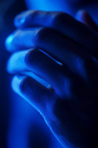 Bioluminescent Cobalt Noir style reference image — wet skin texture