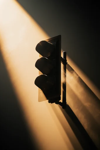 Cinematic Amber Chiaroscuro style reference image — dramatic golden spotlight