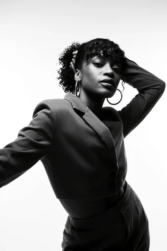 Graphic Monochrome Minimalism style reference image — dynamic editorial pose