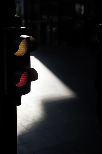 Cinematic Urban Chiaroscuro style reference image — dramatic directional lighting